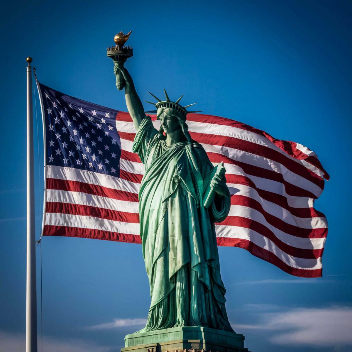 The Statue of Liberty superimposed on top of an American flag